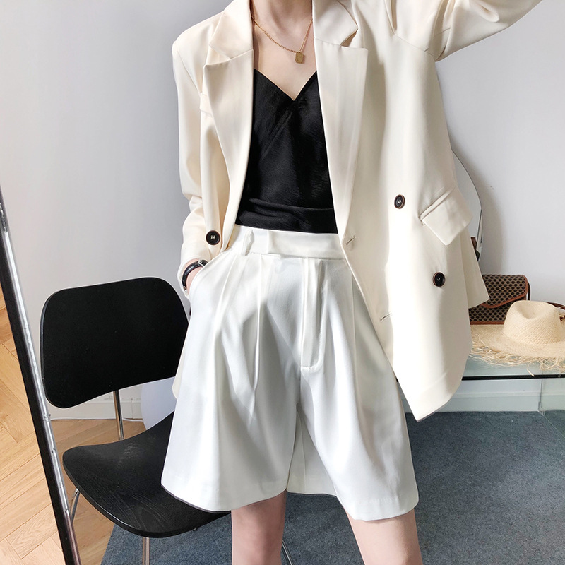 Casual white shorts wears outside business suit for women