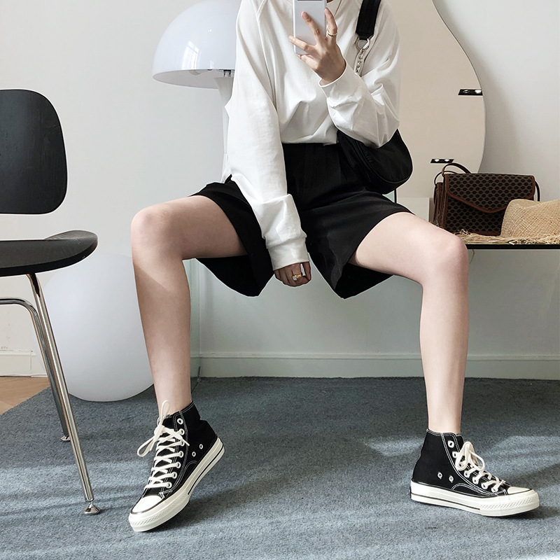 Casual white shorts wears outside business suit for women