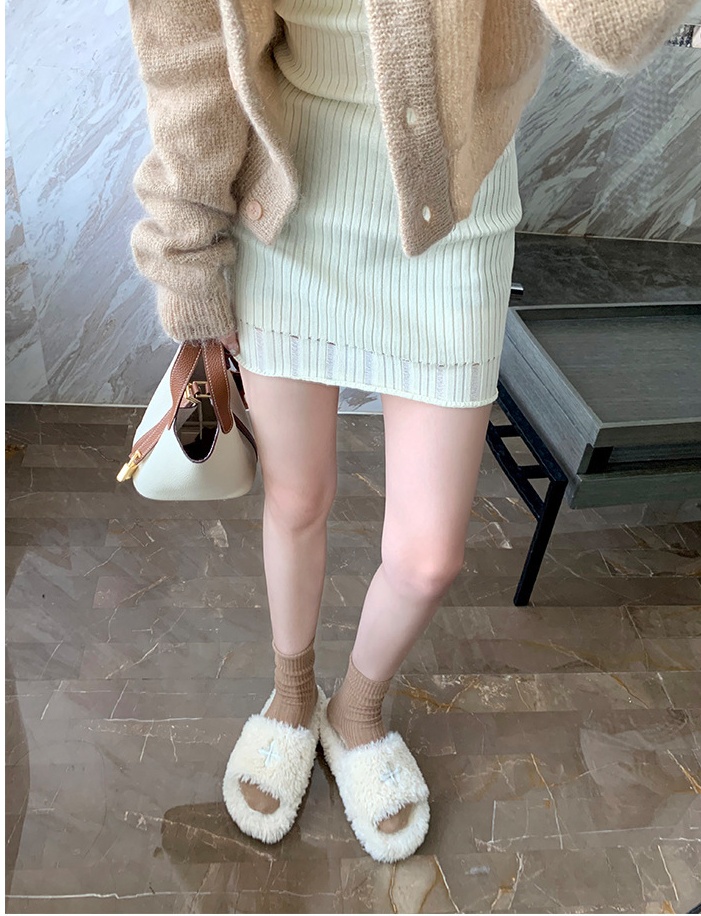 Lady wears outside flat elmo slippers for women