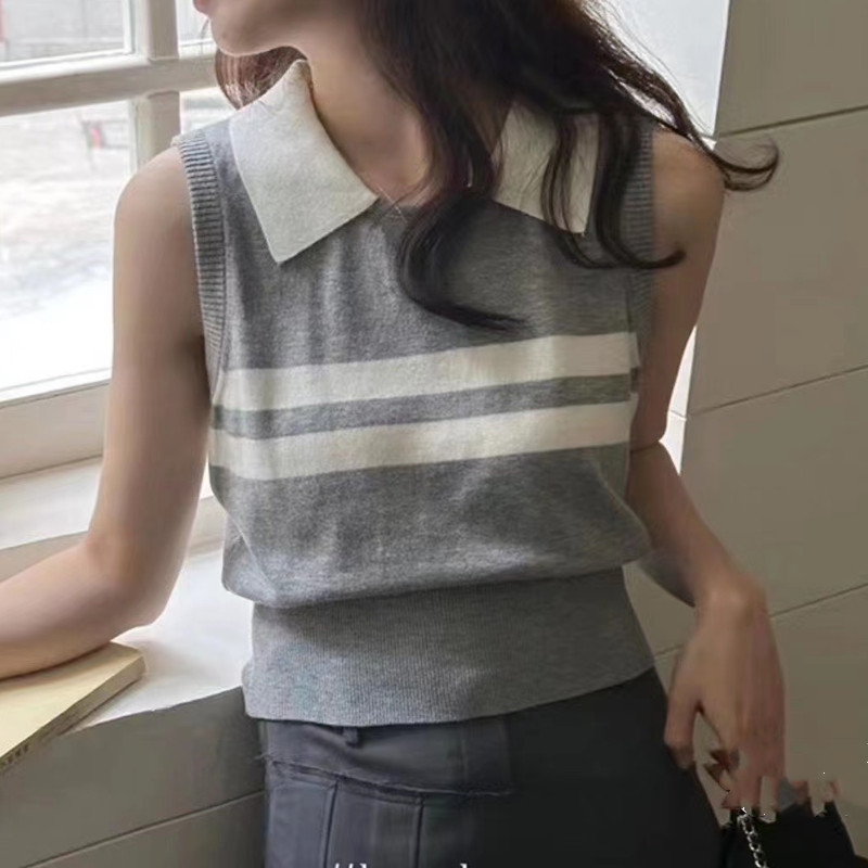 Wears outside mixed colors sweater college style vest