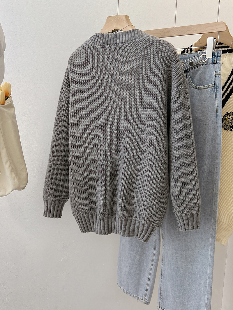 Gray spring knitted sweater wears outside V-neck tops