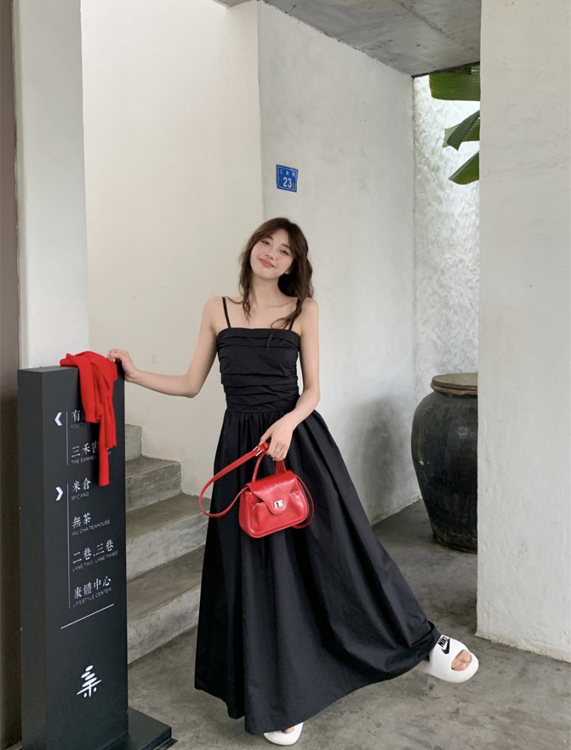 Slim black crimp sling dress