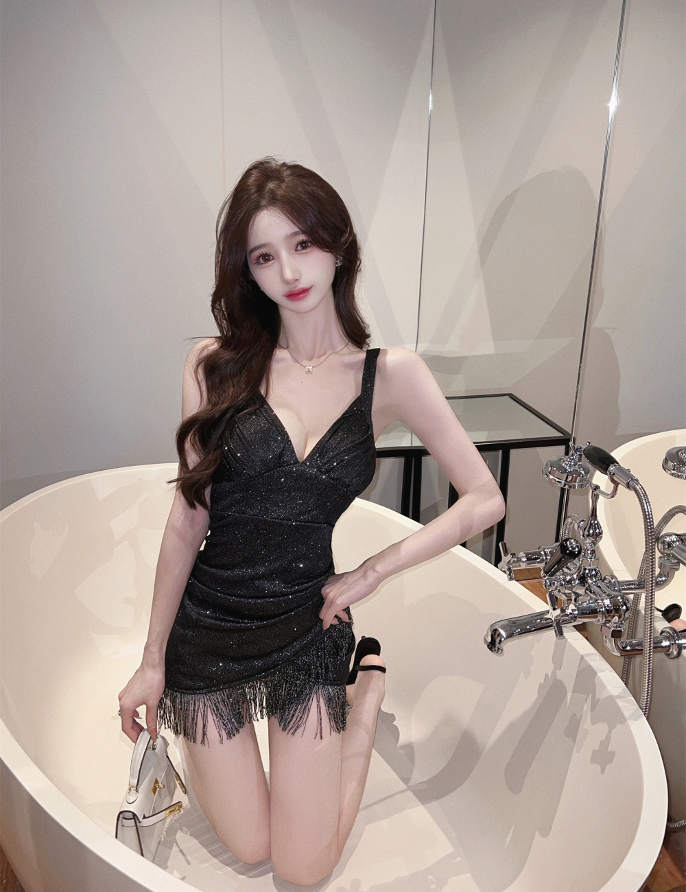 Low-cut package hip sexy sling splice tassels dress