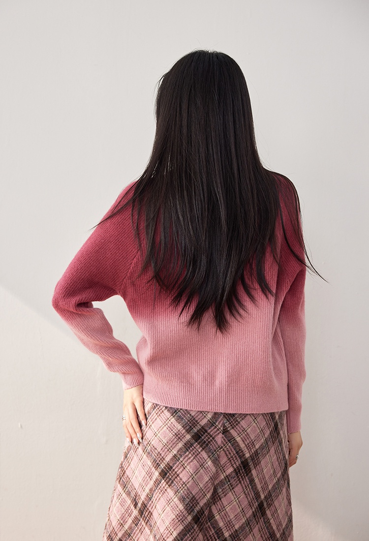 Gradient wears outside cardigan pink sweater