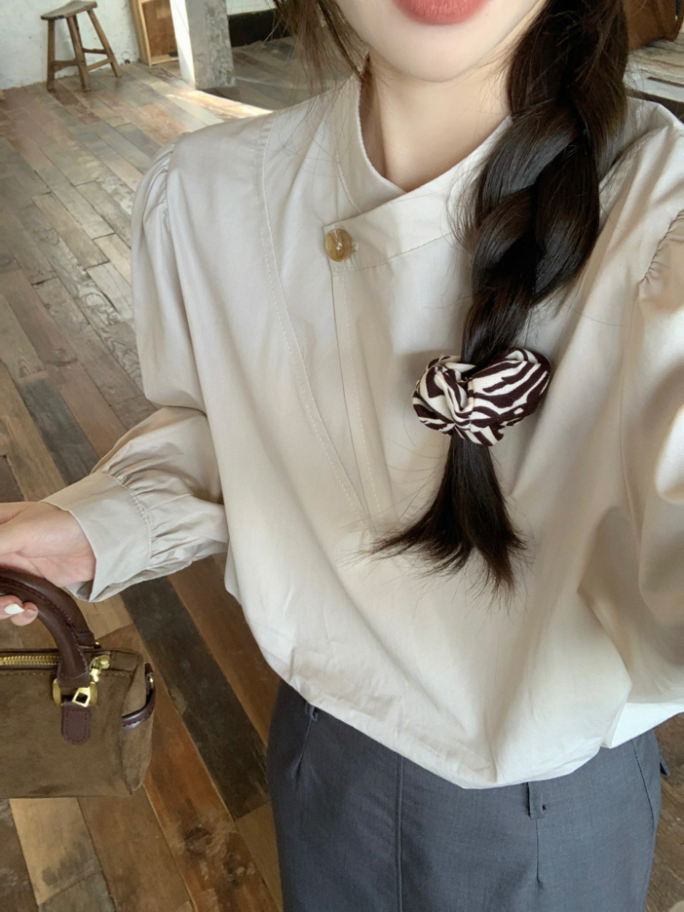 Irregular long sleeve spring buckle slim shirt