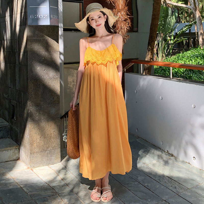 Vacation yellow sandy beach was white sling dress