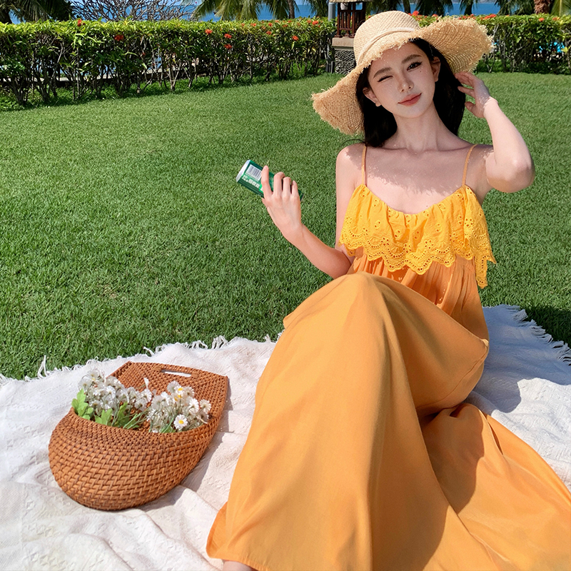 Vacation yellow sandy beach was white sling dress