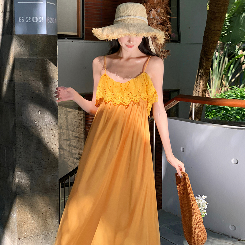 Vacation yellow sandy beach was white sling dress