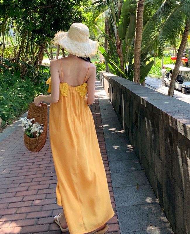 Vacation yellow sandy beach was white sling dress