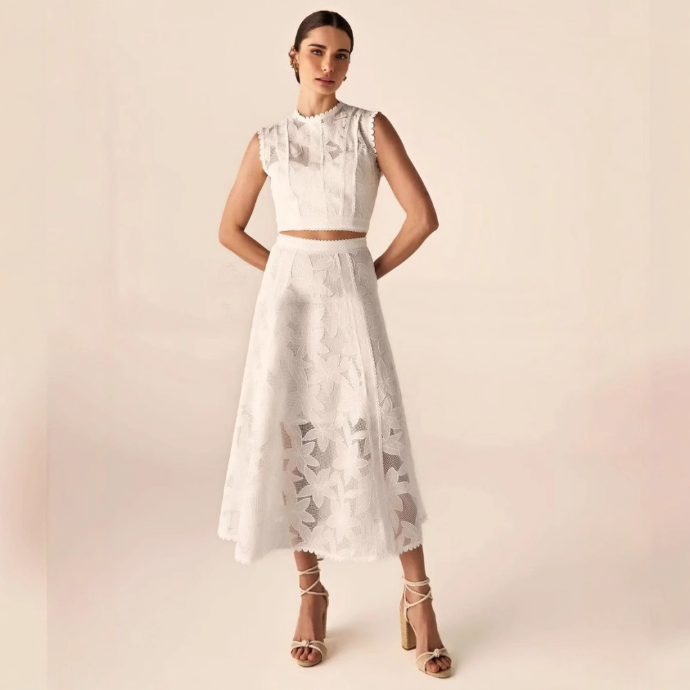 Sleeveless round neck short skirt hollow tops a set