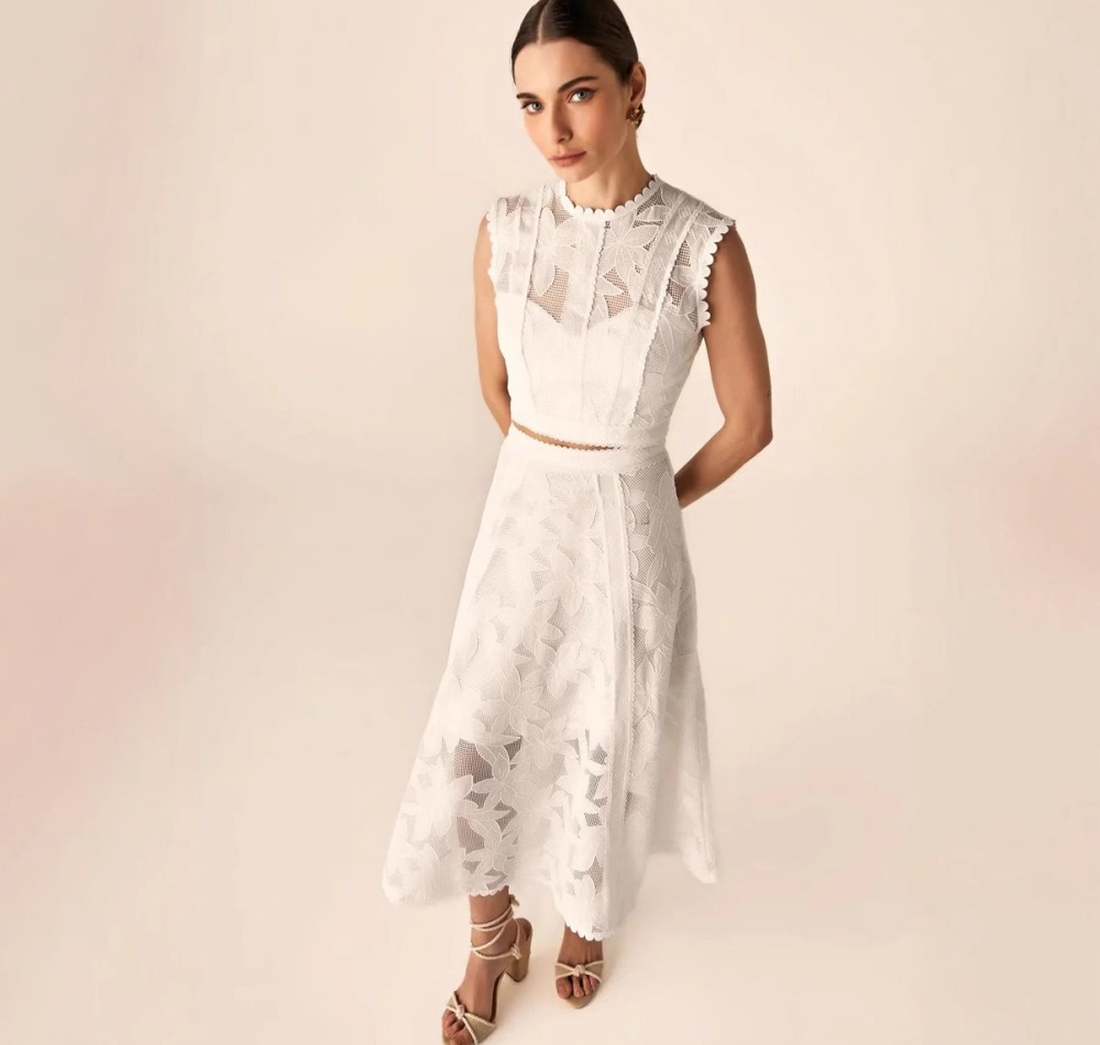Sleeveless round neck short skirt hollow tops a set