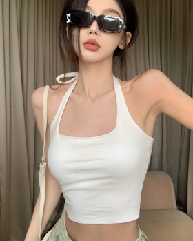 Beauty back wears outside small sling with chest pad tops