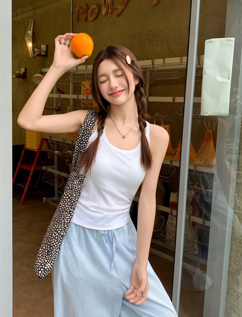 Wears outside tops with chest pad vest for women