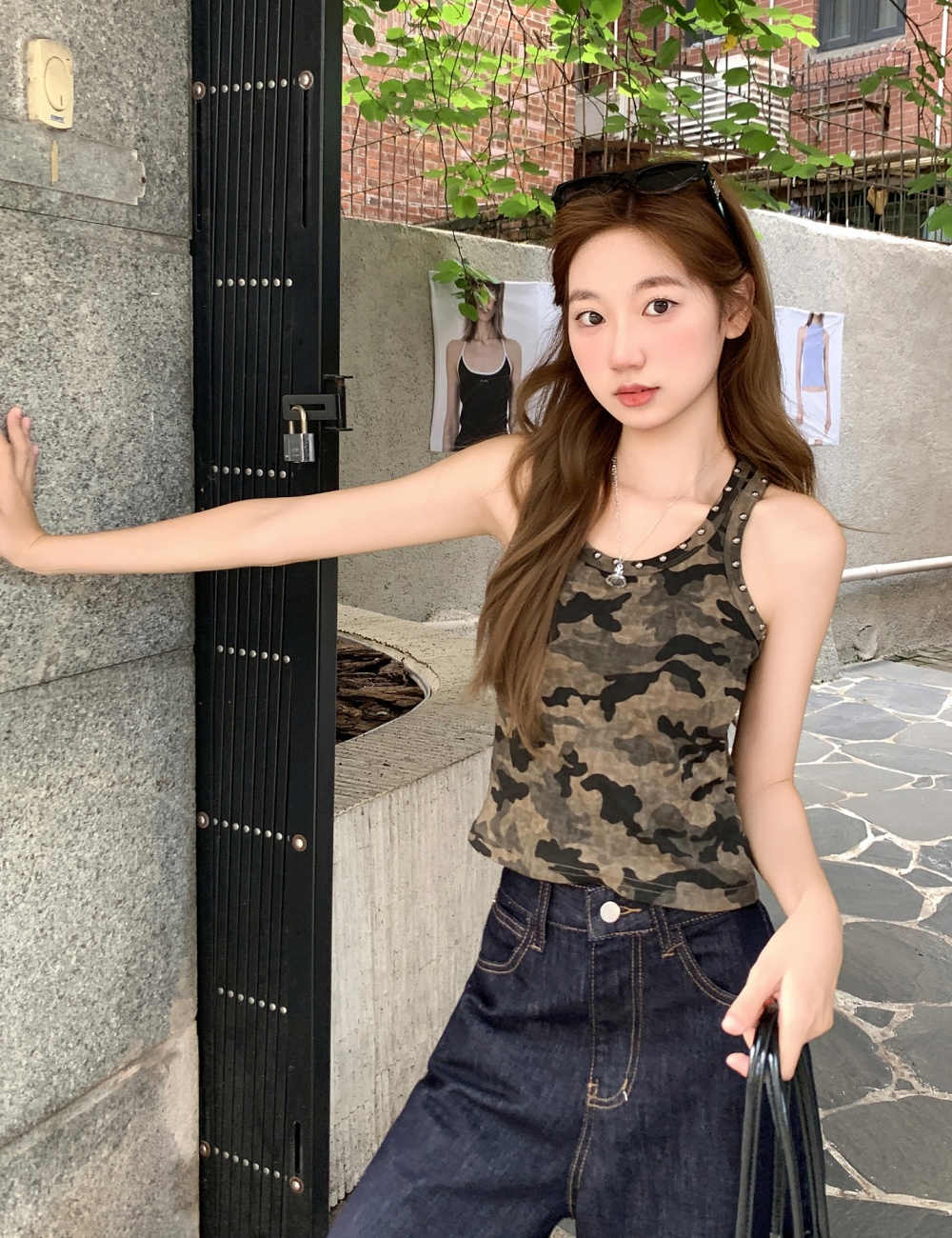 Rivet wears outside work clothing sling vest