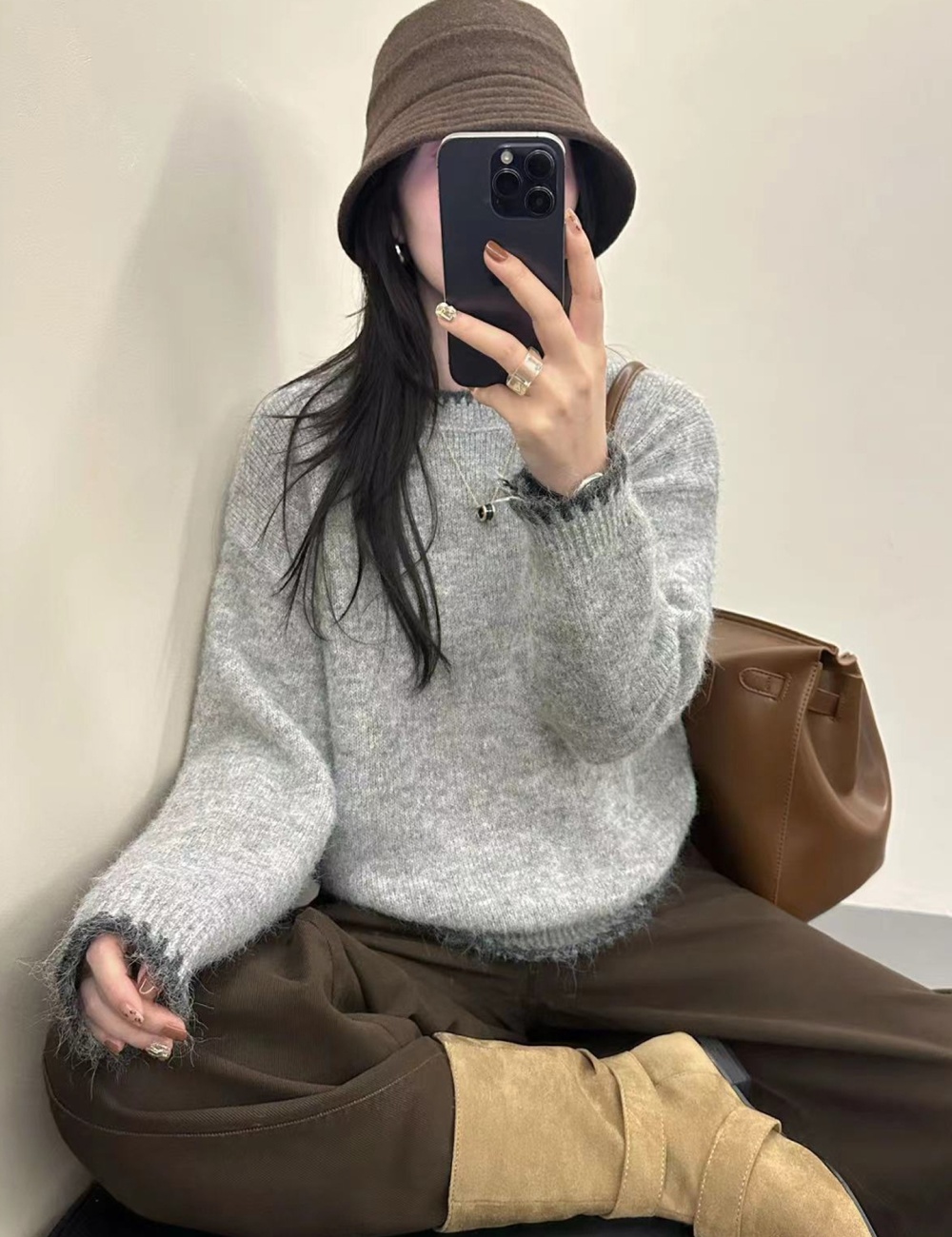 Knitted winter tops wears outside gray sweater