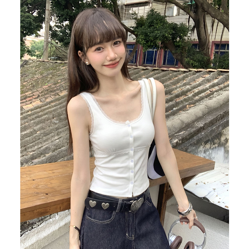 White lace vest wears outside sling cardigan