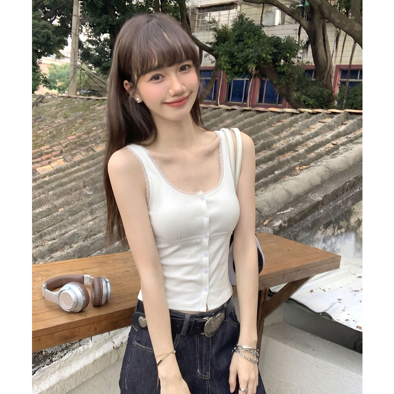 White lace vest wears outside sling cardigan